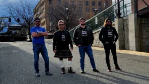 Whiskey Trail band members standing outside on a street